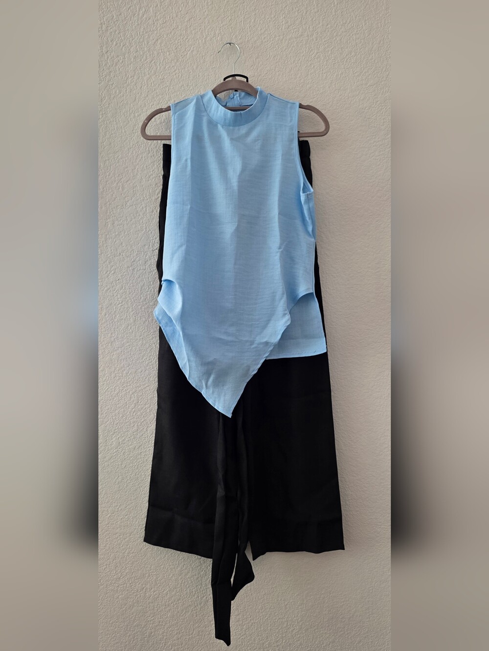 Light Blue Sleeveless Asymmetric Top with Black Wide-Leg Pants